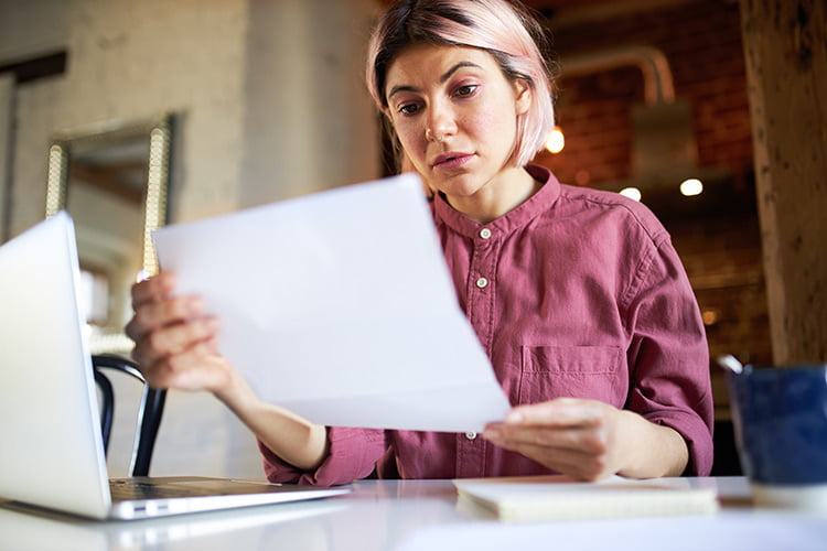 Woman looking on paper