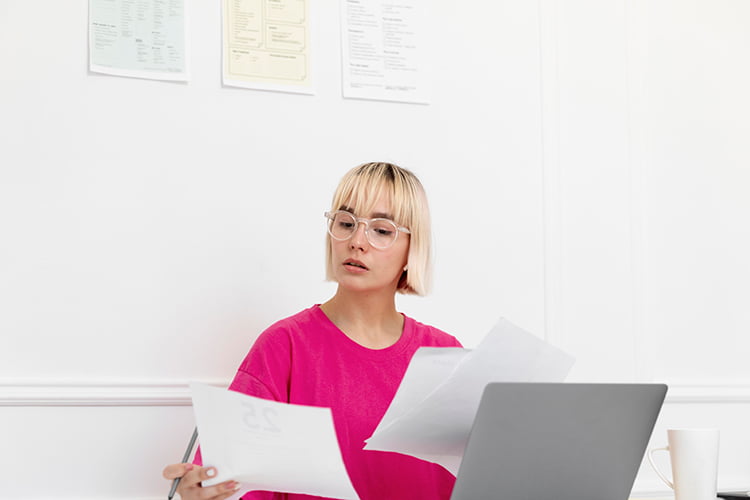 Woman looking on CV Paper